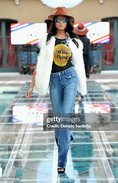 Model walks the runway at the REVOLVE fashion show benefiting Stand Up To Cancer on October 22, 2015 in Los Angeles, California.