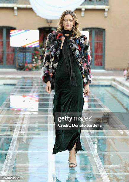 Model walks the runway at the REVOLVE fashion show benefiting Stand Up To Cancer on October 22, 2015 in Los Angeles, California.