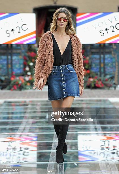 Model walks the runway at the REVOLVE fashion show benefiting Stand Up To Cancer on October 22, 2015 in Los Angeles, California.