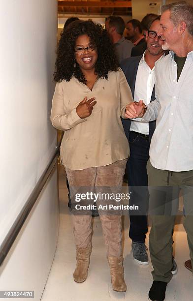 Oprah Winfrey and President of Laird Apparel Tim Garrett attend the launch of Laird Apparel by Laird Hamilton at Ron Robinson on October 22, 2015 in...