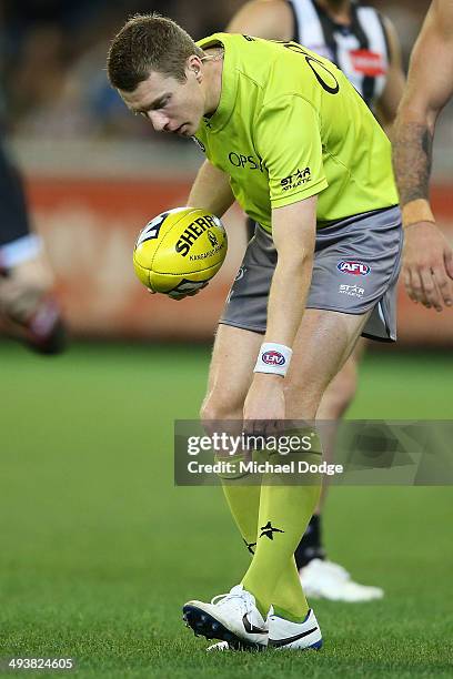 An umpire looks to the ground after Elliott Yeo of the Eagles lost two teeth during the round 10 AFL match between the Collingwood Magpies and West...