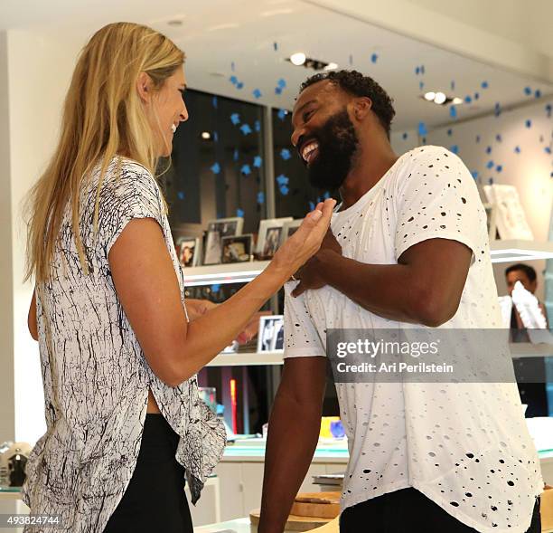 Professional volleyball player Gabrielle Reece and professional basketball player Baron Davis attend the launch of Laird Apparel by Laird Hamilton at...