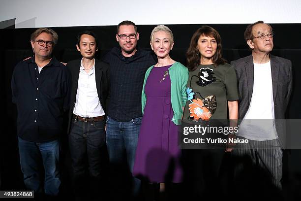 Bent Hamer, Tran Anh Hung, Bryan Singer, Nansun Shi, Susanne Bier, and Kazuki Omori, pose at the end of the Jury Press Conference during the Tokyo...