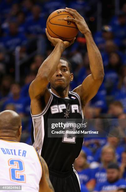 Kawhi Leonard of the San Antonio Spurs shoots in the second quarter against Caron Butler of the Oklahoma City Thunder during Game Three of the...