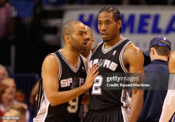 Tony Parker and Kawhi Leonard of the San Antonio Spurs talk in the second quarter against the Oklahoma City Thunder during Game Three of the Western...