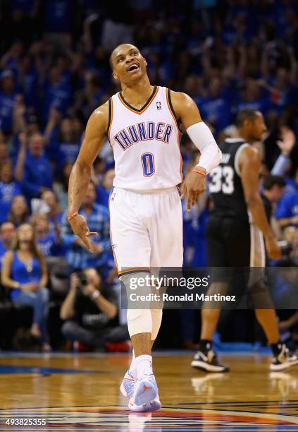 Russell Westbrook of the Oklahoma City Thunder reacts after making a three point basket late in the first half against the San Antonio Spurs during...