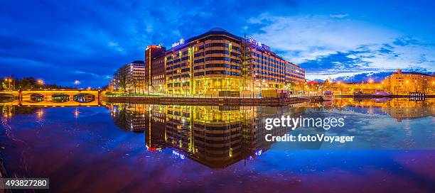 neon night city lake reflection apartments hotels shops helsinki finland - helsinki stock pictures, royalty-free photos & images