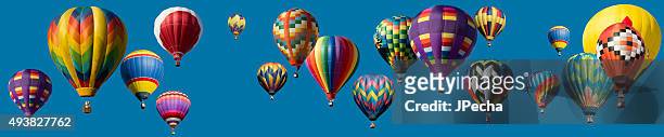 panoramic composite hot air balloons flying over blue clear sky - hot air balloon stock pictures, royalty-free photos & images