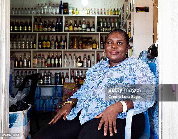 shop owner at work in west africa - sole proprietorship stock pictures, royalty-free photos & images