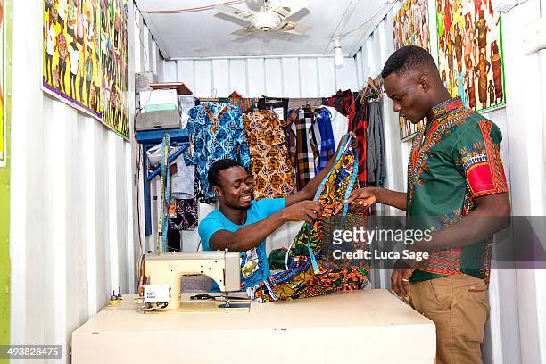 african sole trader tailor at work - accra stock pictures, royalty-free photos & images