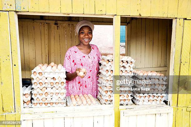 sole trader serving from her shop - ghana woman stock pictures, royalty-free photos & images