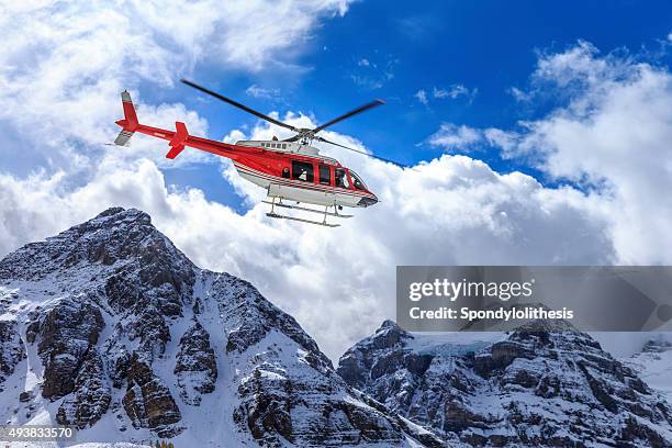 helicopter at assiniboine lodge and magog lake - intervention stock pictures, royalty-free photos & images