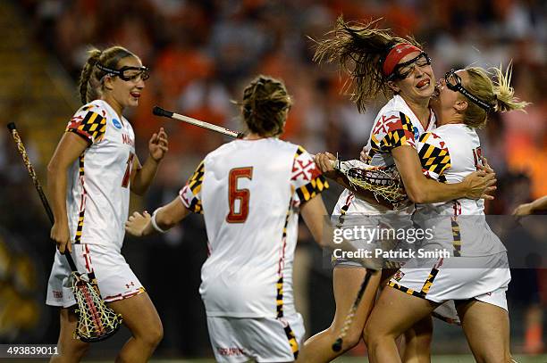 Taylor Cummings of the Maryland Terrapins celebrates with teammates after scoring against the Syracuse Orange in the first half during the NCAA...