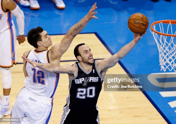 Manu Ginobili of the San Antonio Spurs drives to the basket against Steven Adams of the Oklahoma City Thunder in the first half during Game Three of...