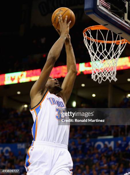 Kevin Durant of the Oklahoma City Thunder goes up for a dunk in the third quarter against the San Antonio Spurs during Game Three of the Western...