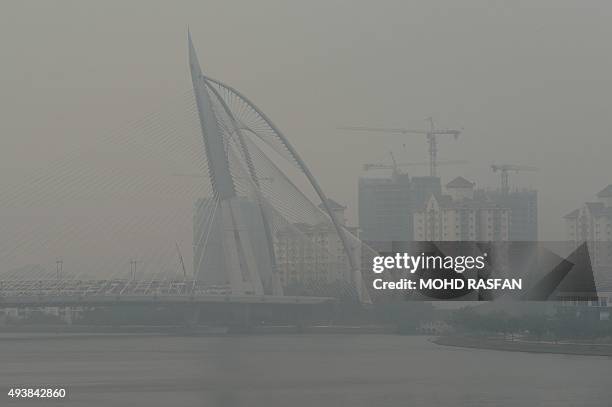 The Seri Wawasan bridge is seen covered by haze in Putrajaya on October 23, 2015. Fires raging across huge areas of Indonesia are spewing more...
