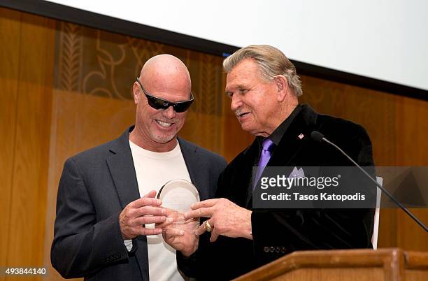 Jim McMahon former Chicago Bear quaterback gets a award from Mike Ditka former Chicago Bears coach at The Christopher and Dana Reeve Foundation...