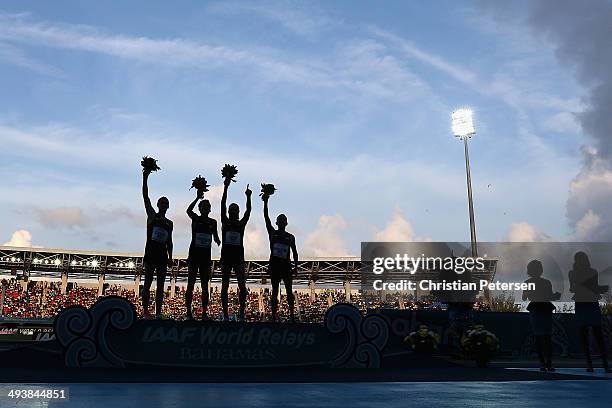 Patrick Casey, David Torrence, Will Leer and Leonel Manzano of the United States celebrate on the podium after taking second place in the Men's...