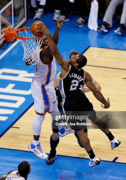 Kawhi Leonard of the San Antonio Spurs goes up for a dunk against Serge Ibaka of the Oklahoma City Thunder in the second half during Game Three of...