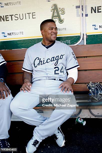 Dayan Viciedo of the Chicago White Sox sits in the dugout prior to the game against the Oakland Athletics at O.co Coliseum on May 13, 2014 in...