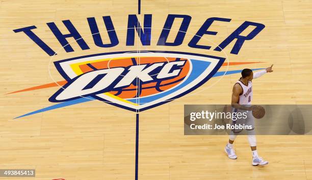 Russell Westbrook of the Oklahoma City Thunder brings the ball up the floor in the second half against the San Antonio Spurs during Game Three of the...