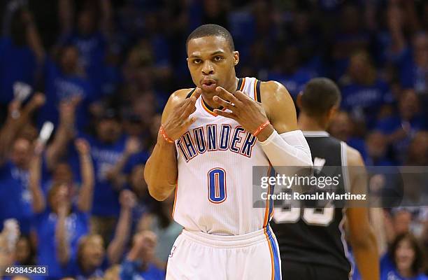 Russell Westbrook of the Oklahoma City Thunder reacts after making a three point basket late in the first half against the San Antonio Spurs during...