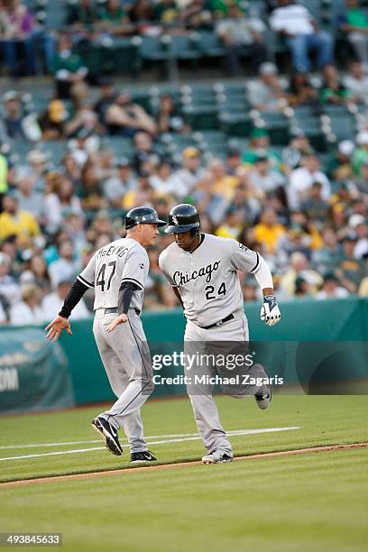 Dayan Viciedo of the Chicago White Sox is congratulated after hitting a home run during the game against the Oakland Athletics at O.co Coliseum on...