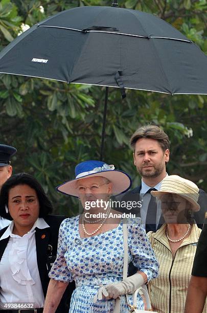 Danish Queen Margrethe II is accompanied by Indonesian officials during her visit to the Kalibata Hero Graveyard in Jakarta, Indonesia, on October...