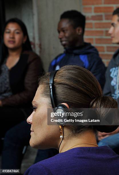 Crown Princess Victoria of Sweden listens to a group of youngsters during a visit to the enterprise driven project 'Ruta Motor' on October 22, 2015...