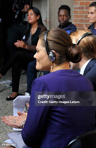 Crown Princess Victoria of Sweden and Prince Daniel of Sweden listen to a group of youngsters during a visit to the enterprise driven project 'Ruta...
