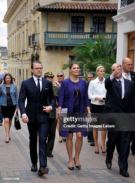 Crown Princess Victoria of Sweden and Prince Daniel of Sweden walk down a street of downtown Bogota after holding a private meeting with Colombia's...