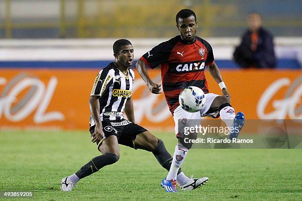 Junior Cesar of Botafogo battles for the ball with Airton of Vitoria during the match between Botafogo and Vitoria as part of Brazilian Series A 2014...