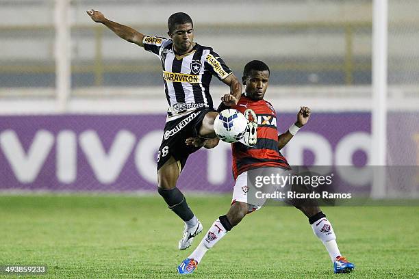 Junior Cesar of Botafogo battles for the ball with Airton of Vitoria during the match between Botafogo and Vitoria as part of Brazilian Series A 2014...