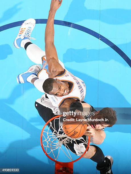 Aron Baynes of the San Antonio Spurs dunks against Serge Ibaka of the Oklahoma City Thunder in Game Three of the Western Conference Finals during the...