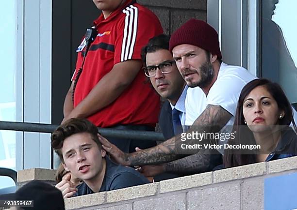 Former Los Angeles Galaxy players David Beckham , Jovan Kirovsky and Beckham's son Brooklyn attend the MLS match between Philadelphia Union and the...
