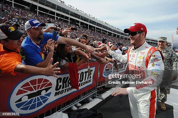 Dale Earnhardt Jr., driver of the National Guard/Superman Chevrolet, greets fans during pre-race ceremonies for the NASCAR Sprint Cup Series...