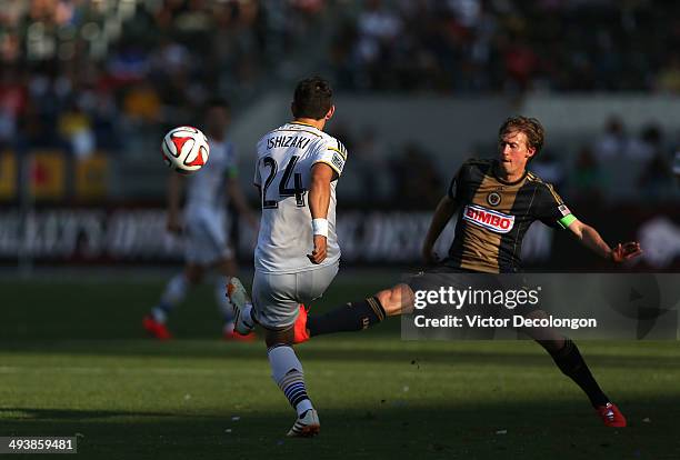 Stefan Ishizaki of Los Angeles Galaxy plays from the ball Brian Carroll of Philadelphia Union in the second half of their MLS match at StubHub Center...