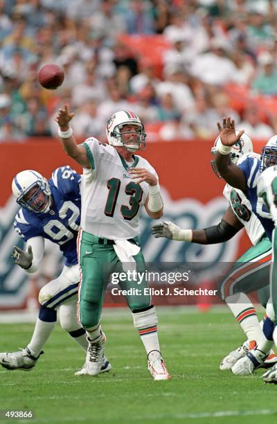 Dan Marino of the Miami Dolphins passes the ball during the game against the Indianapolis Colts at the Pro Players Stadium in Miami, Florida. The...