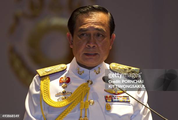 Thai army chief General Prayut Chan-O-Cha speaks during a press conference at the army headquarters in Bangkok on May 26, 2014. Thailand's king has...