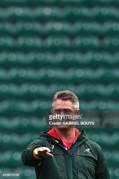 South Africa's head coach Heyneke Meyer watches his players during the captain's run at Twickenham Stadium, west of London, on October 23 on the eve...
