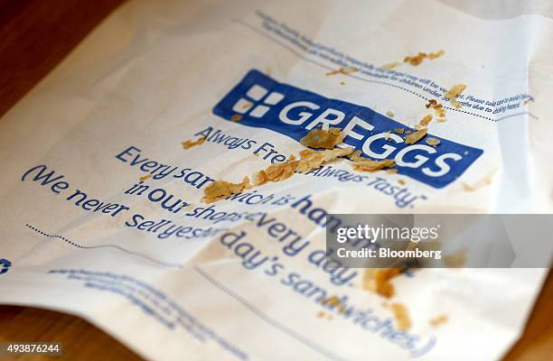 Crumbs from a finished pastry product sit on a bag in a Greggs Plc sandwich chain outlet in Caterham, U.K., on Thursday, Oct. 22, 2015. Same-store...