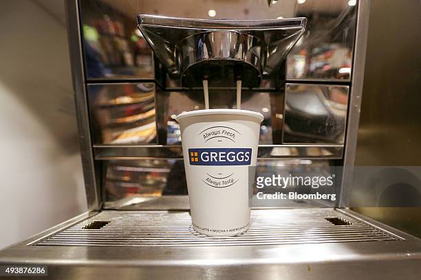 Coffee pours into a cup in a Greggs Plc sandwich chain outlet in Caterham, U.K., on Thursday, Oct. 22, 2015. Same-store sales at Greggs have grown...