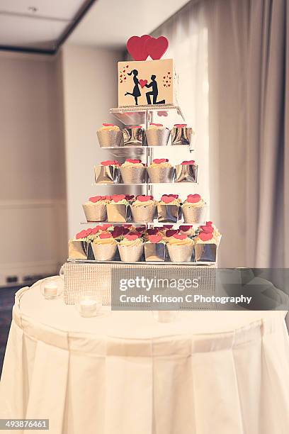 engagement cupcake cake. - round table with table cloth stock pictures, royalty-free photos & images