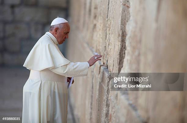 Pope Francis prays by the Western Wall on May 26, 2014 in Jerusalen, Israel. Pope Francis arrived in Israel on Sunday afternoon, a day after landing...