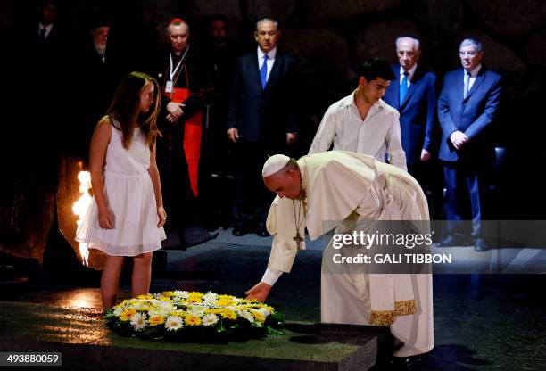 Pope Francis lays a wreath at the Hall of Remembrance on May 26 during his visit to the Yad Vashem Holocaust Memorial museum in Jerusalem...