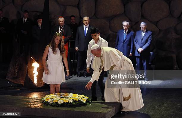 Pope Francis lays a wreath at the Hall of Remembrance on May 26 during his visit to the Yad Vashem Holocaust Memorial museum in Jerusalem...