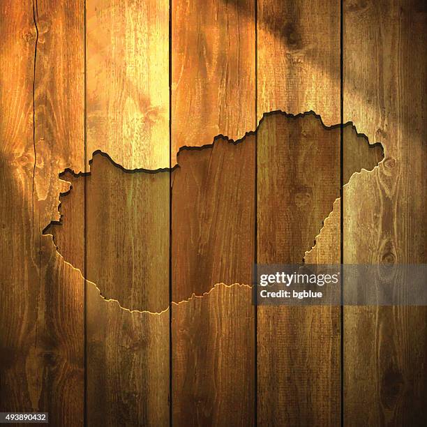 hungary map on lit wooden background - budapest stock illustrations