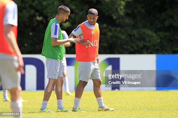 Hakim Ziyech, Tonny Vilhena playing rock paper scissors during a training session of The Netherlands U21 at vv DUNO on may 22, 2014 in Doorwerth, The...