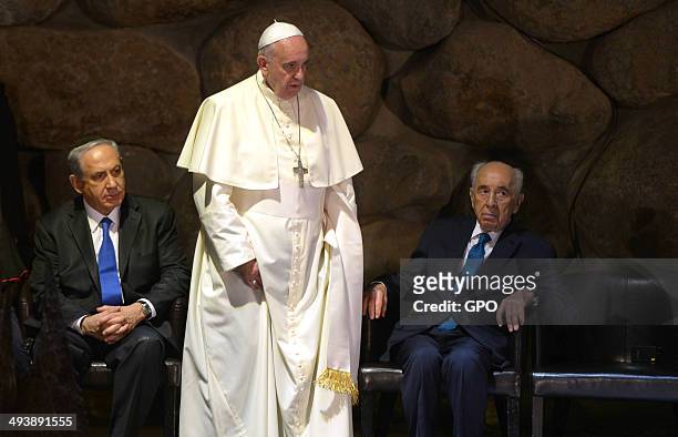 In this handout provided by the Israeli Government Press Office , Pope Francis visits the Yad Vashem Holocaust Museum with Israeli President Shimon...
