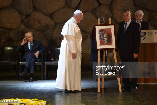 In this handout provided by the Israeli Government Press Office , Pope Francis visits the Yad Vashem Holocaust Museum, on May 26, 2014 in Jerusalem,...